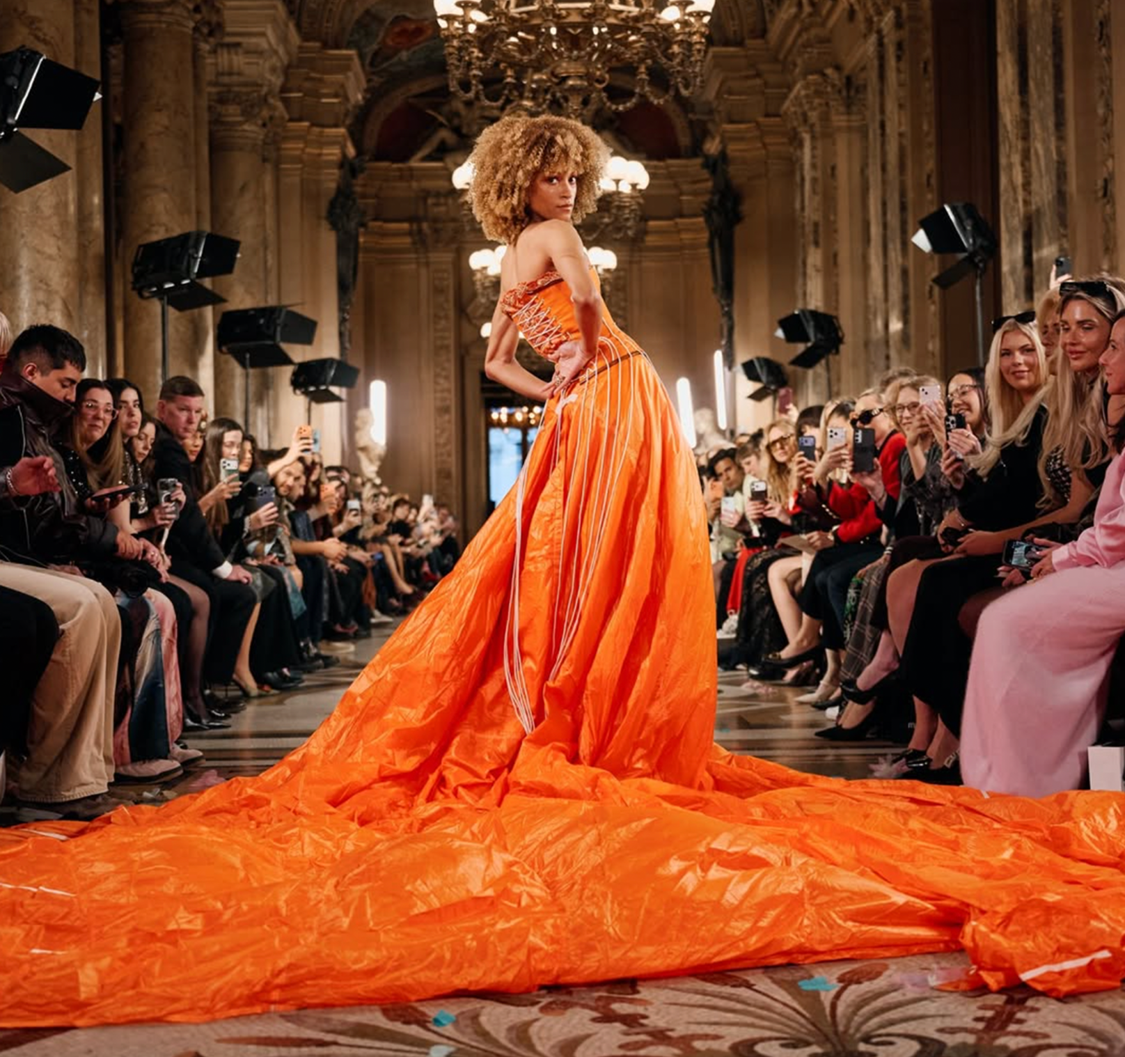 Max Alexander on runway presenting his collection in high fashion