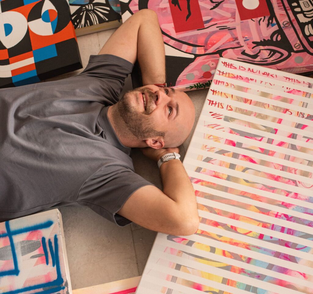 AWOK working in his studio while developing a new composition inspired by geometry, color, and architecture.